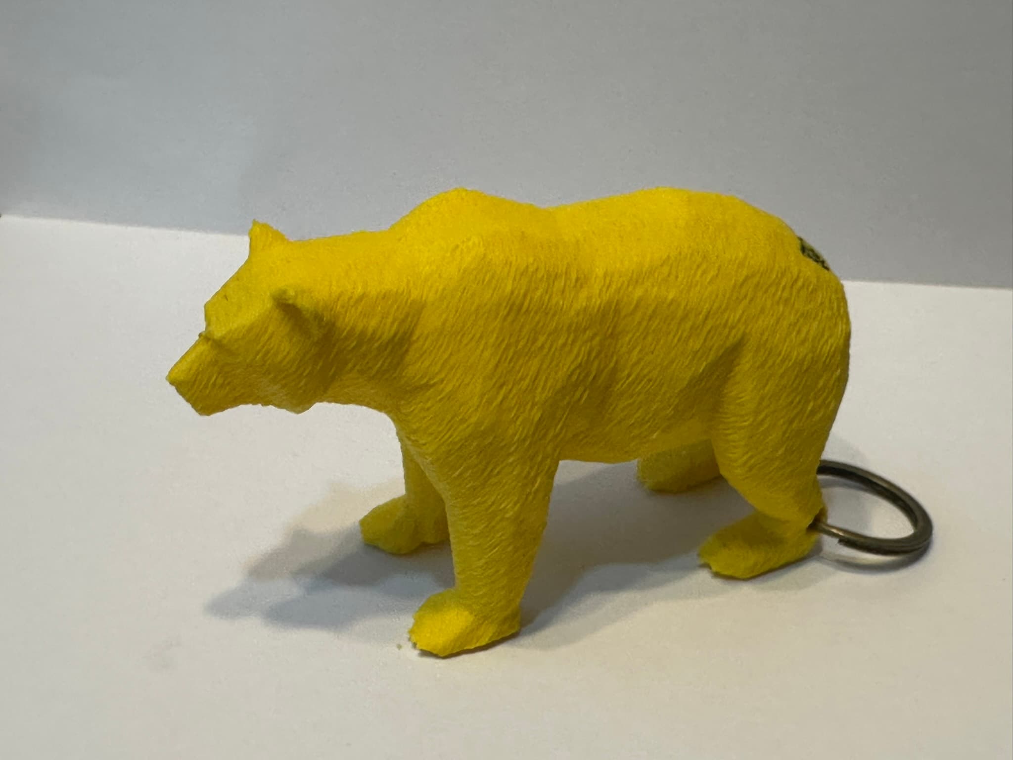 Bright yellow floating bear keychain